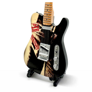 Miniature electric guitar with 'The Rolling Stones' branding on a white background